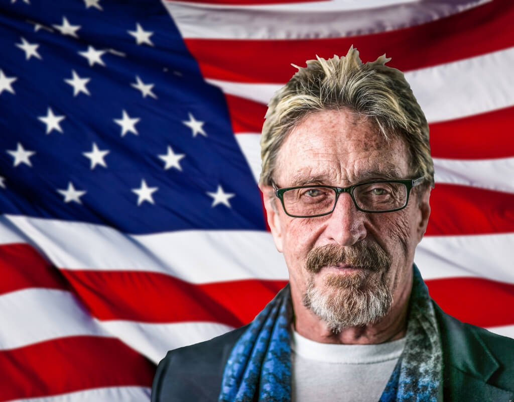 John McAfee super-imposed in front of an American flag.