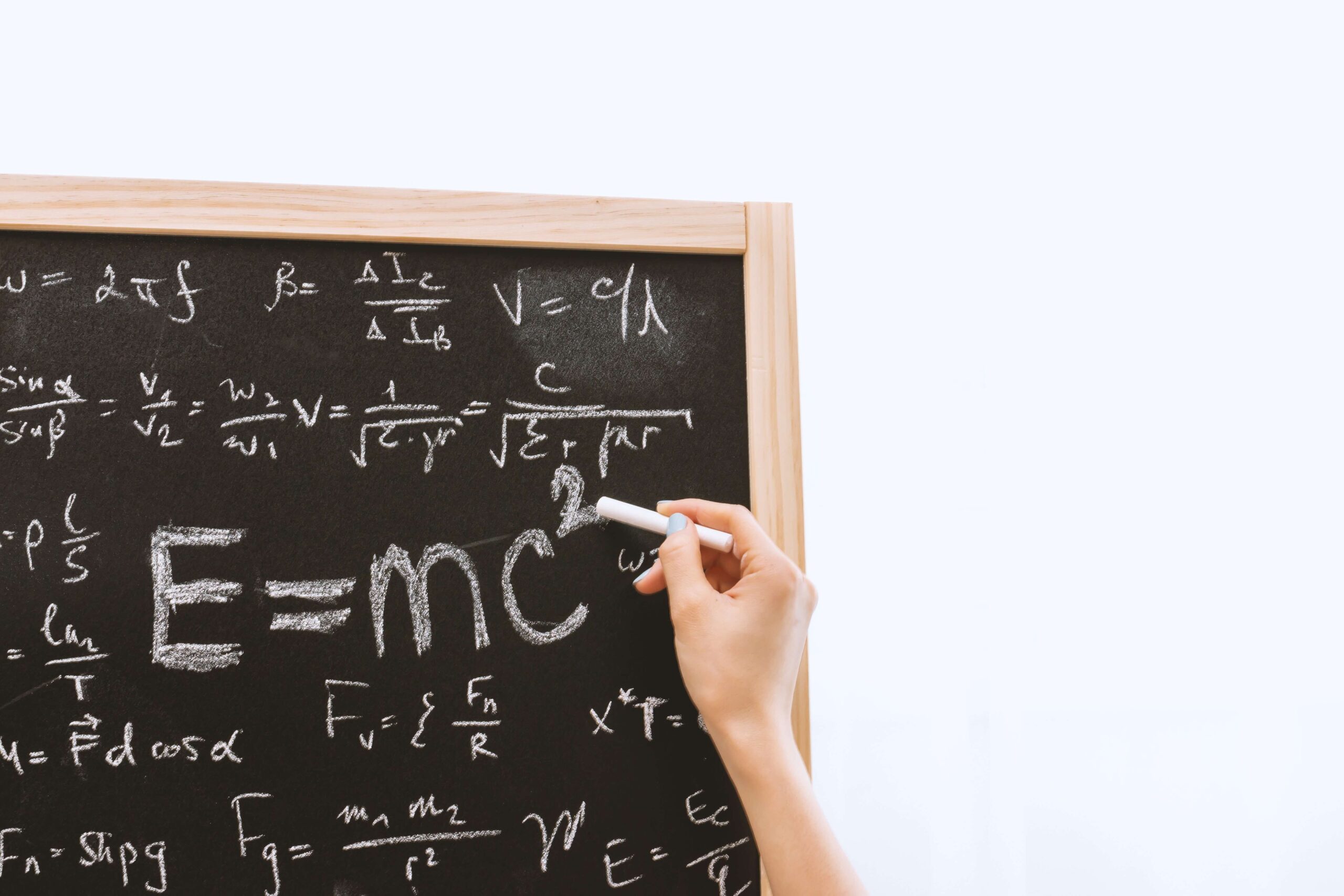 An image of maths equations on a blackboard.