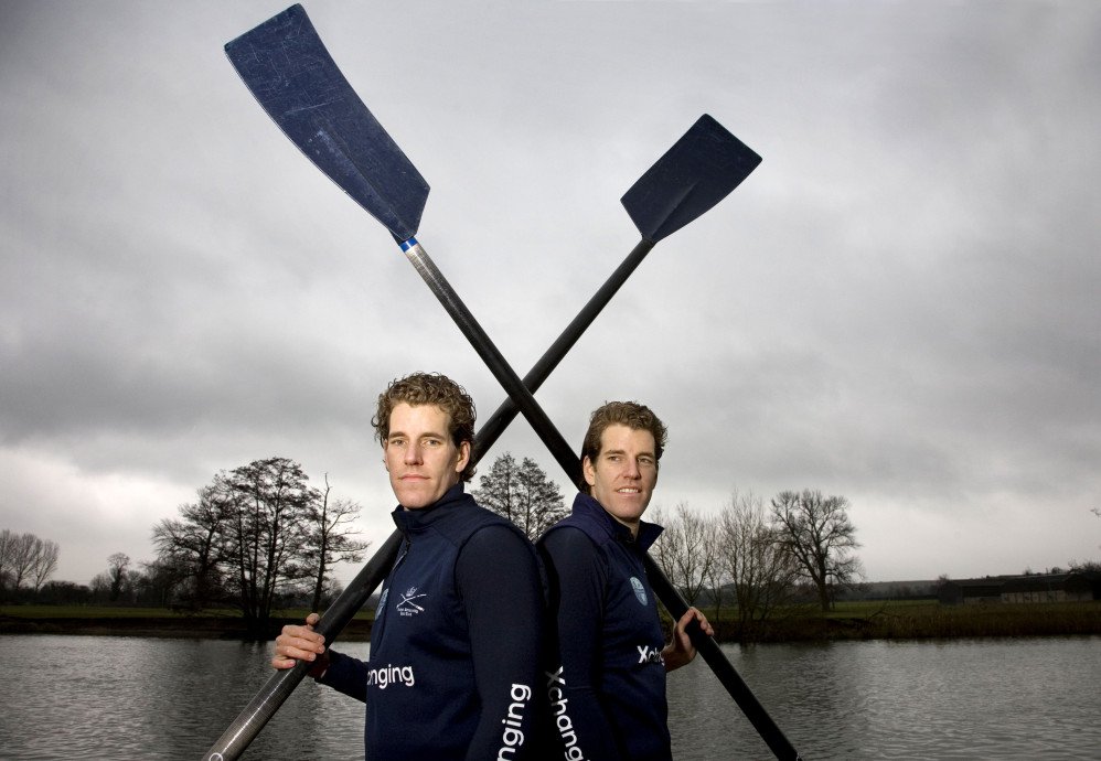 Famous Bitcoin billionaires Winklevoss twins posing with oars 