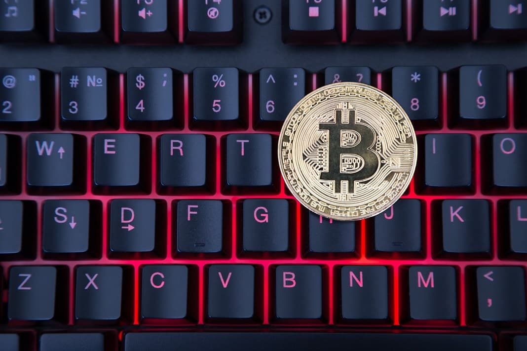 bitcoin lies on the computer keyboard